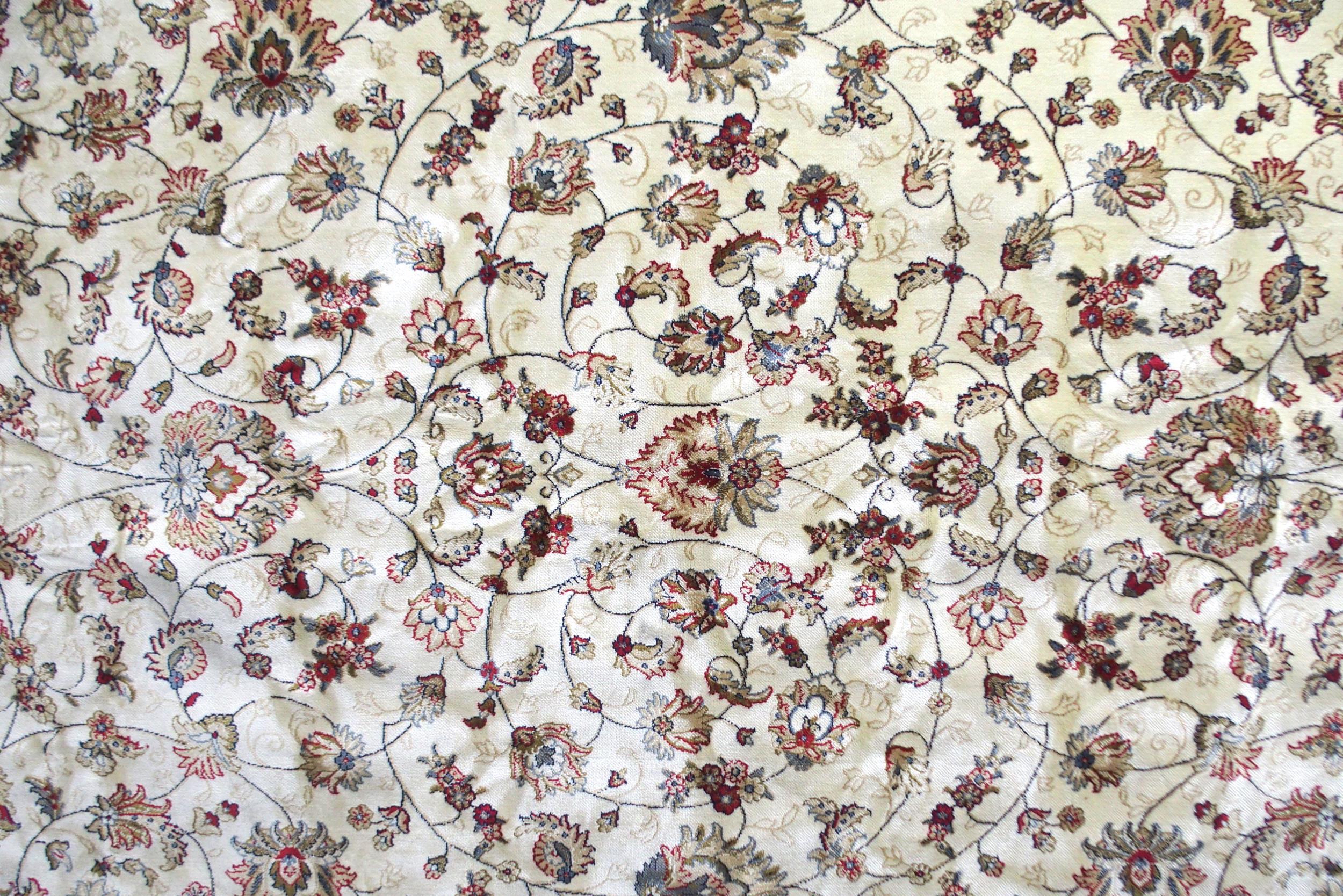 A cream ground machine made Kashmiri rug with all-over floral design and flower head borders, - Image 2 of 6