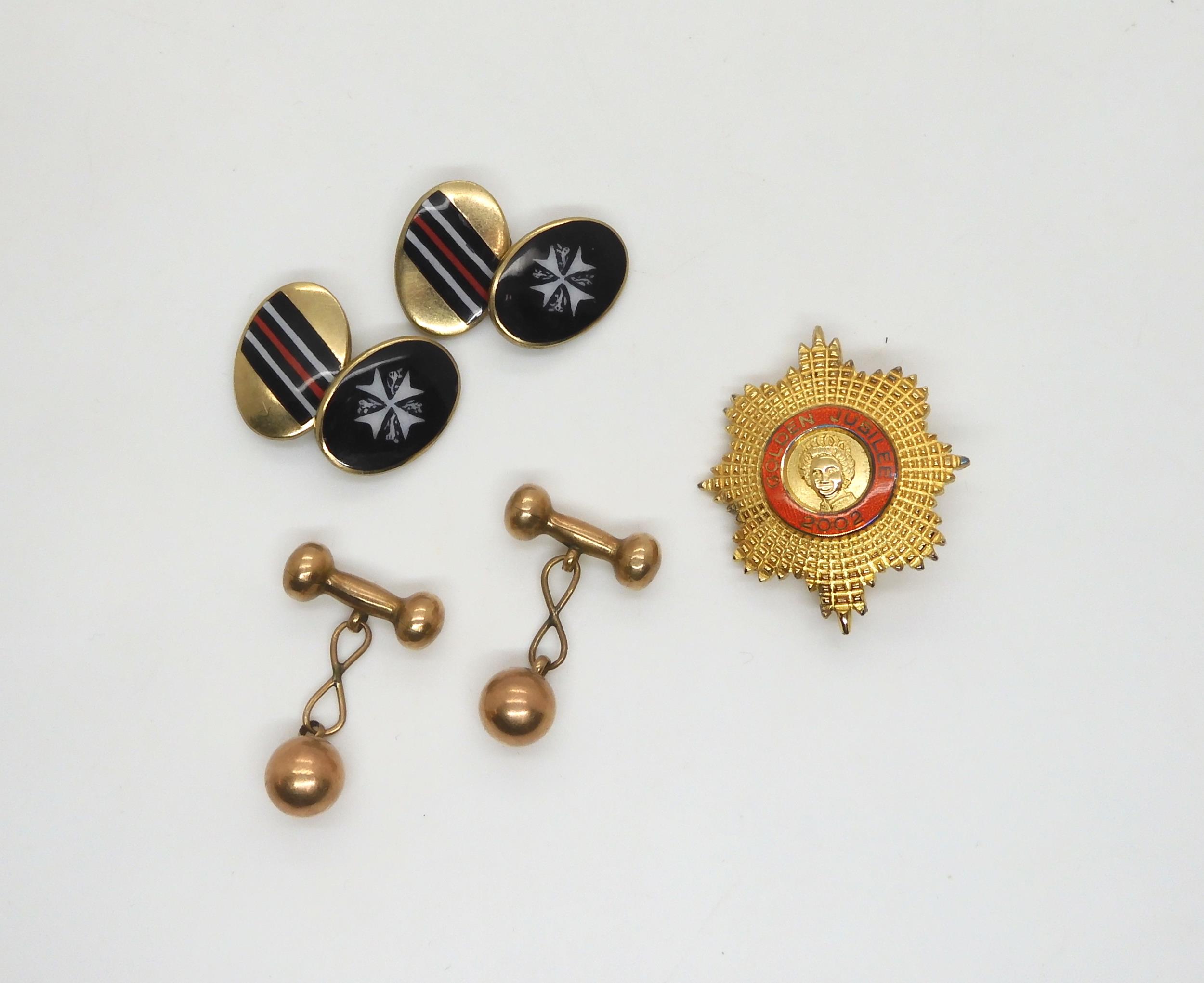 A pair of 9ct gold dumbbell shaped cufflinks, weight 4.1gms, a gold plated Golden Jubilee badge