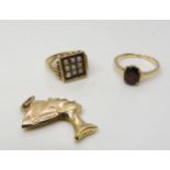 A 9ct gold Nefertiti pendant, 9ct garnet ring, size N, and a yellow metal pearl set ring, size N,