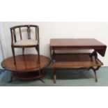 A lot of three assorted mahogany coffee tables and an Edwardian tub chair (4) Condition Report: