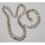 A long and heavy silver curb chain necklace with similar bracelet, length of necklace 61.5cm,