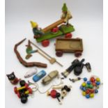 A collection of vintage toys, including an incomplete Pelham Minnie Mouse puppet, a Shuco