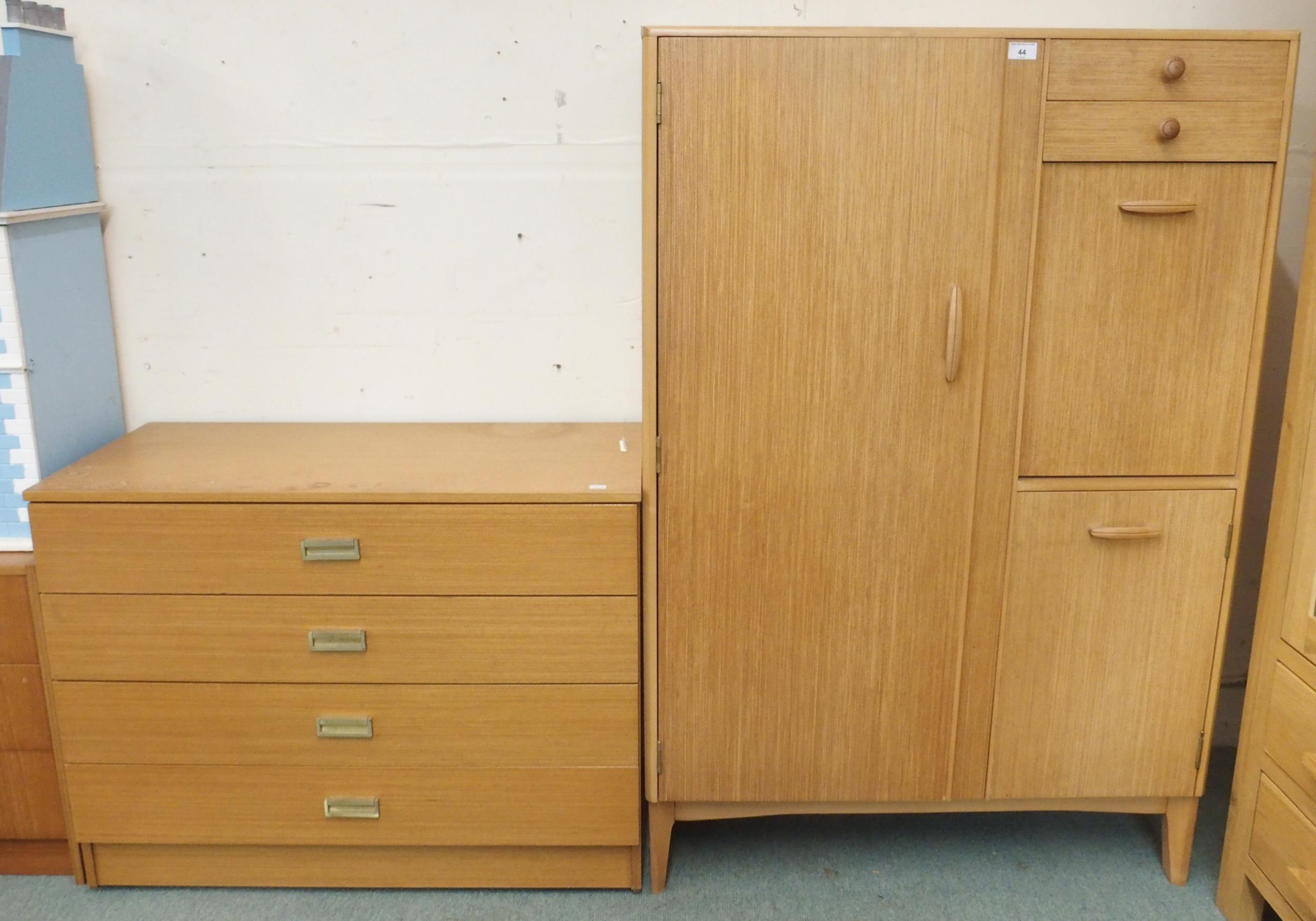 A mid 20th century teak veneered Remploy bachelors wardrobe, 135cm high x 90cm wide x 47cm deep