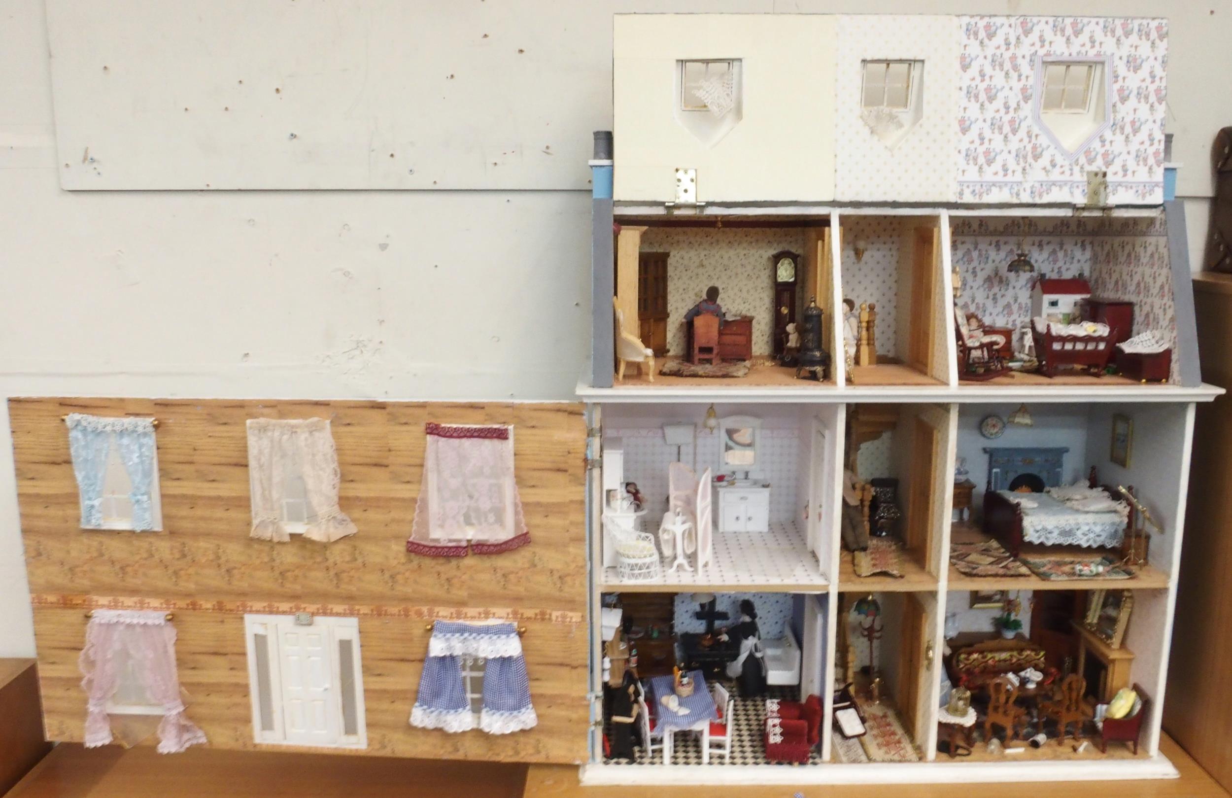 A 20th century three storey dolls house with assorted furniture and figures etc, 84cm high x 80cm - Image 13 of 13