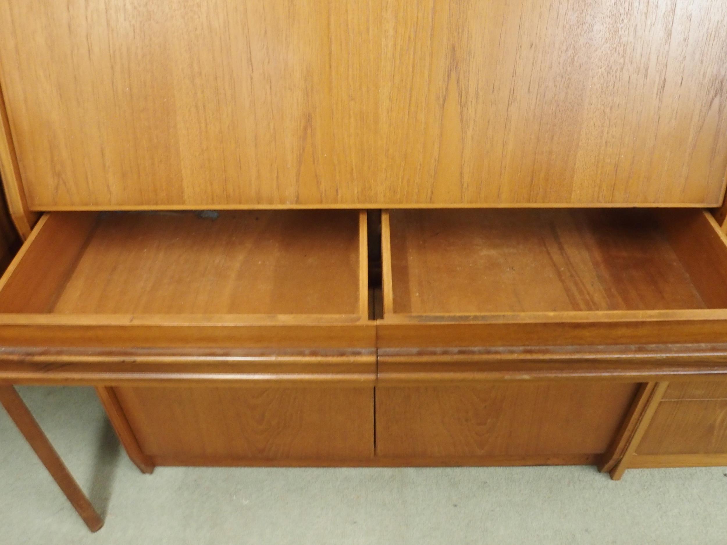 A mid 20th century teak writing bureau with fitted fall front writing compartment over two drawers - Image 4 of 5