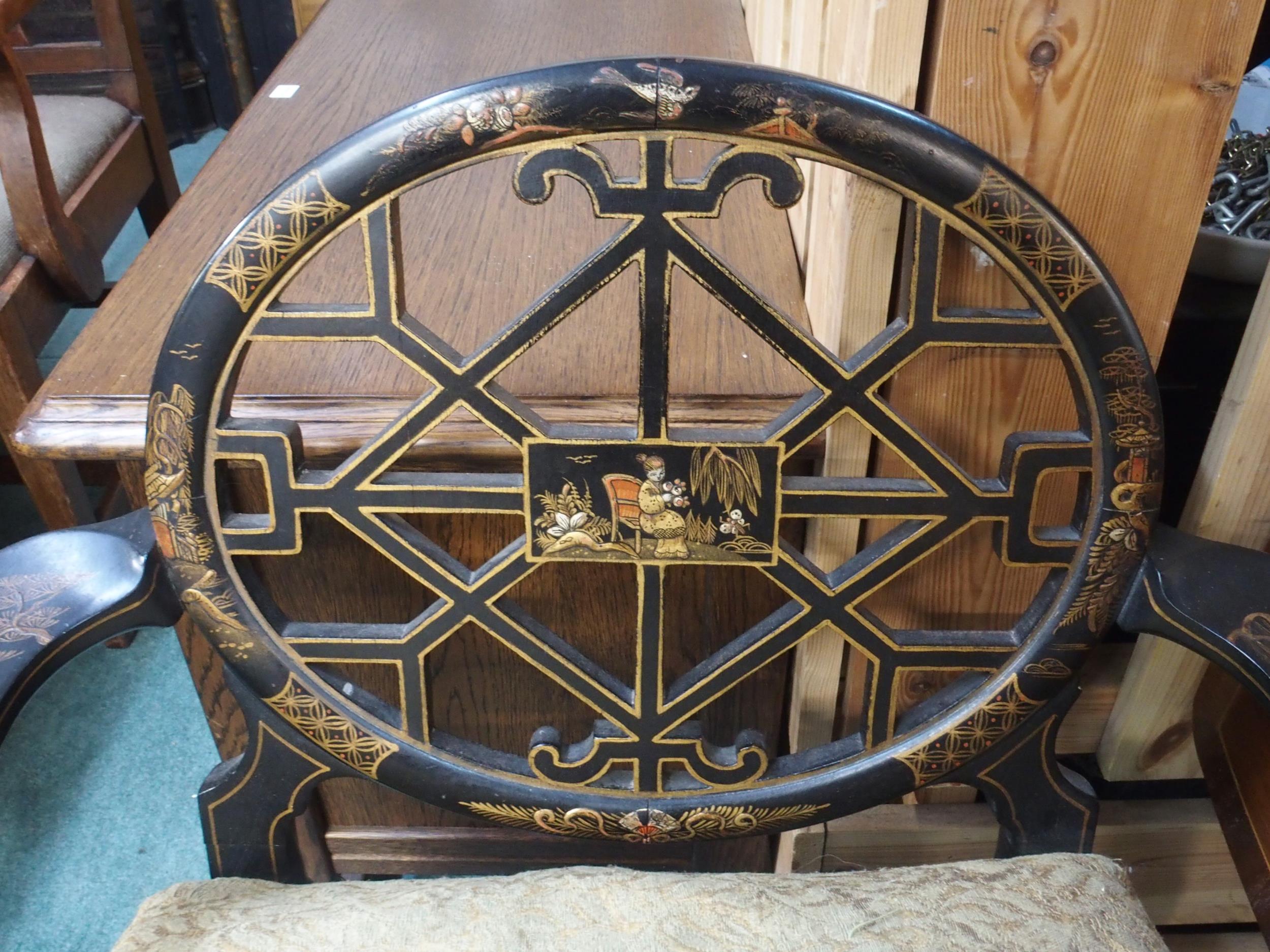 A 19th century Oriental ebonised open armchair with fret work splat on ball and claw supports, - Image 2 of 4