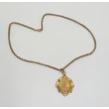 A 9ct gold curling medallion on a vintage 9ct chain, length 46cm, weight together 18gms Condition