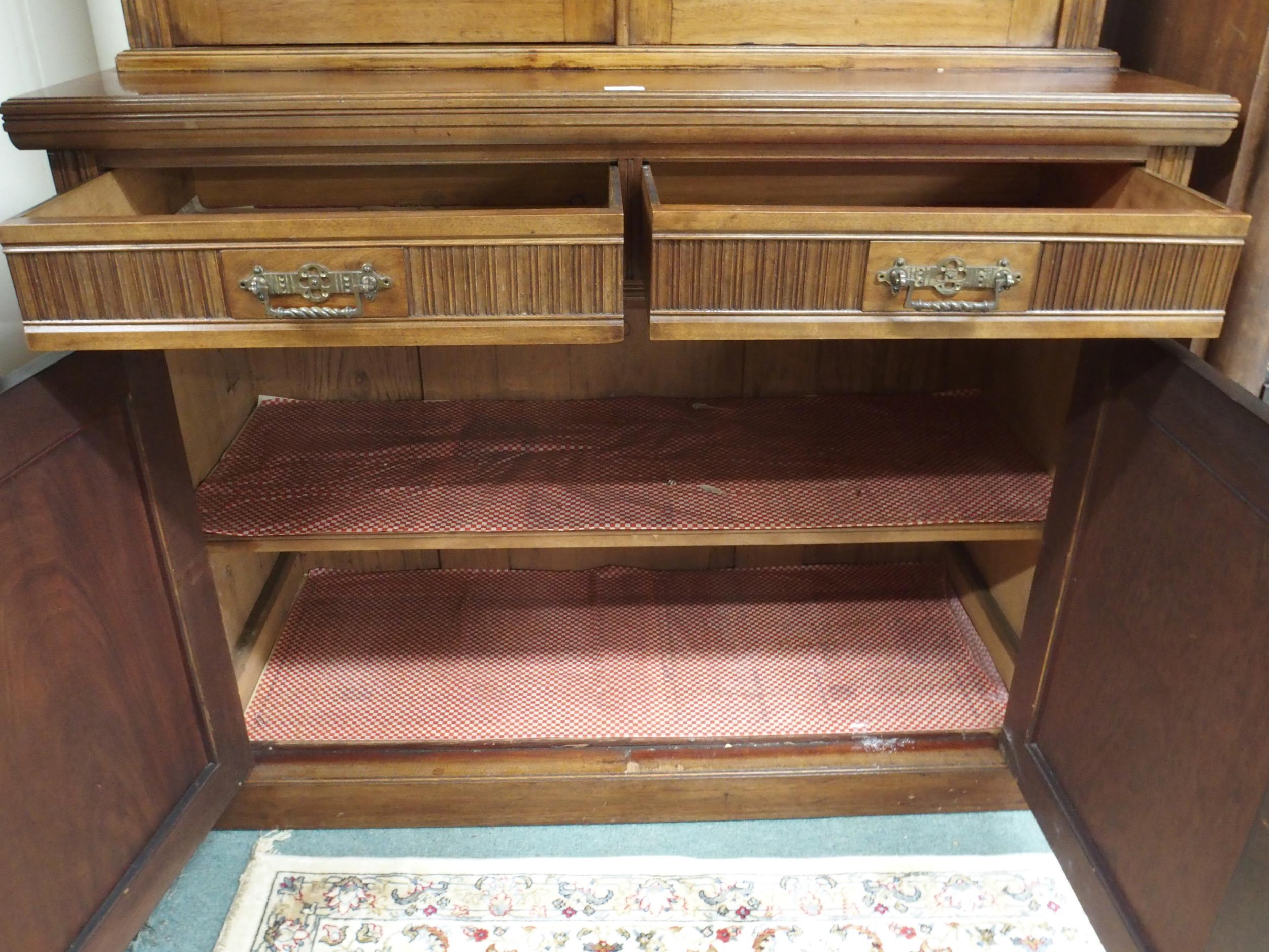 A Victorian mahogany bookcase on base with moulded cornice over pair of glazed doors over drawers - Image 3 of 5