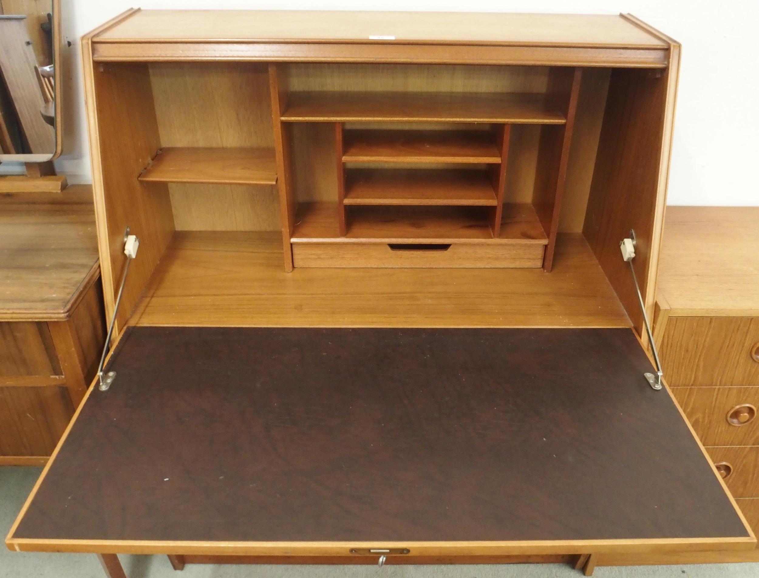 A mid 20th century teak writing bureau with fitted fall front writing compartment over two drawers - Image 2 of 5