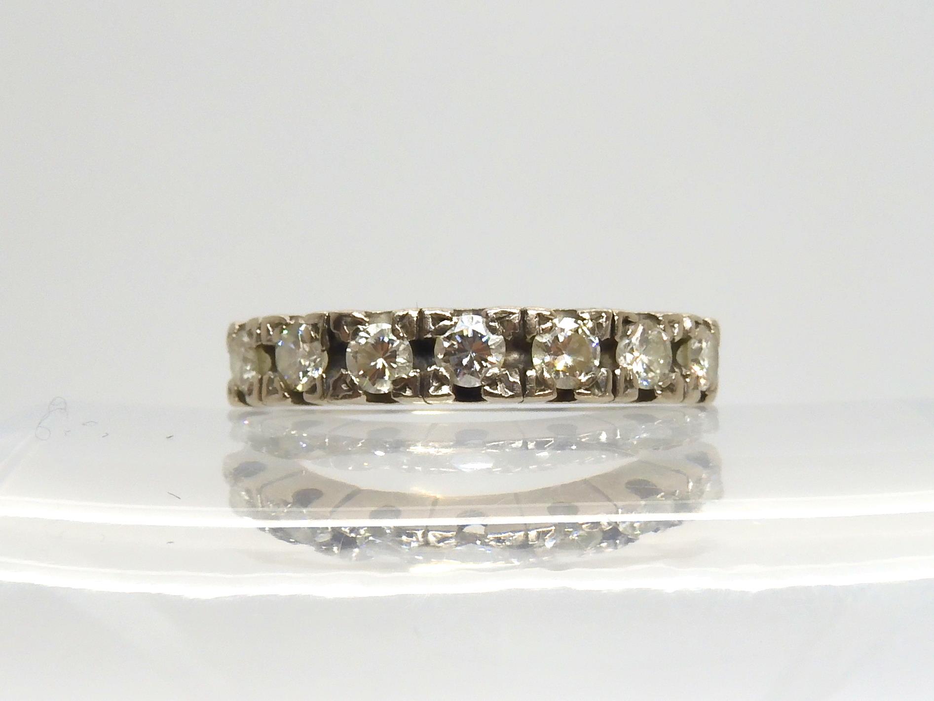 An 18ct white gold seven diamond eternity ring set with estimated approx 0.70cts of brilliant