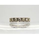 An 18ct white gold seven diamond eternity ring set with estimated approx 0.70cts of brilliant