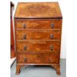 A 20th century mahogany bureau with fall front writing compartment over four drawers, 104cm high x