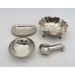A collection of silver including a lobed bowl, on four scroll paw feet, by race Woodward & Co Ltd,