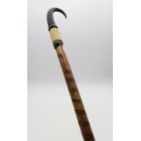 An Alpine hiking pole/staff with handle constructed from the horn and foot of the chamois goat,