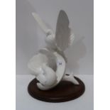 A large white glazed Royal Doulton Images sculpture of two doves, titled The Homecoming Condition