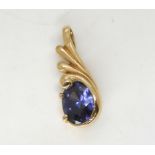 A tanzanite pendant in bright yellow metal, length 2.5cm, weight 2.4gms Condition Report:Available