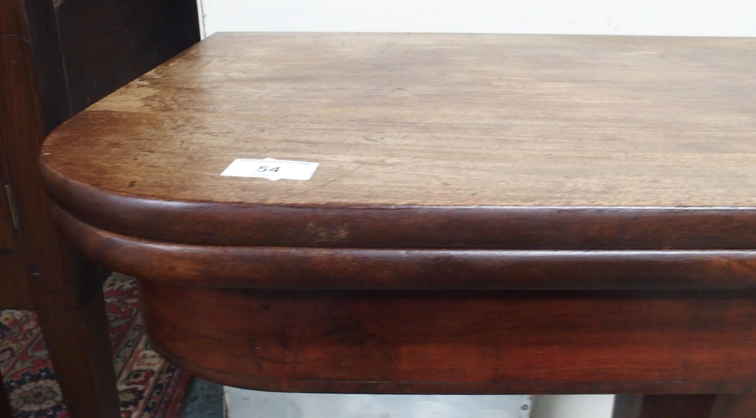 A Victorian mahogany fold-over tea table on octagonal pedestal terminating in scrolled quadrupedal - Image 3 of 4