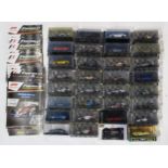 A quantity of Formula 1: the Car Collection model cars by Panini, still packaged, with corresponding