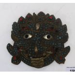 A Tibetan metal mask with glass bead decoration Condition Report:Available upon request