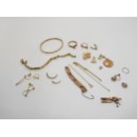 A collection of 9ct gold items to include a bangle, a coin mount, watch straps etc, weight all