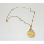A 1911 full gold sovereign in a 9ct pendant mount with a 50cm long 9ct gold belcher chain, weight