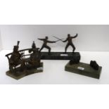 A spelter figure group of two men fencing, together with a see no evil, speak no evil, hear no