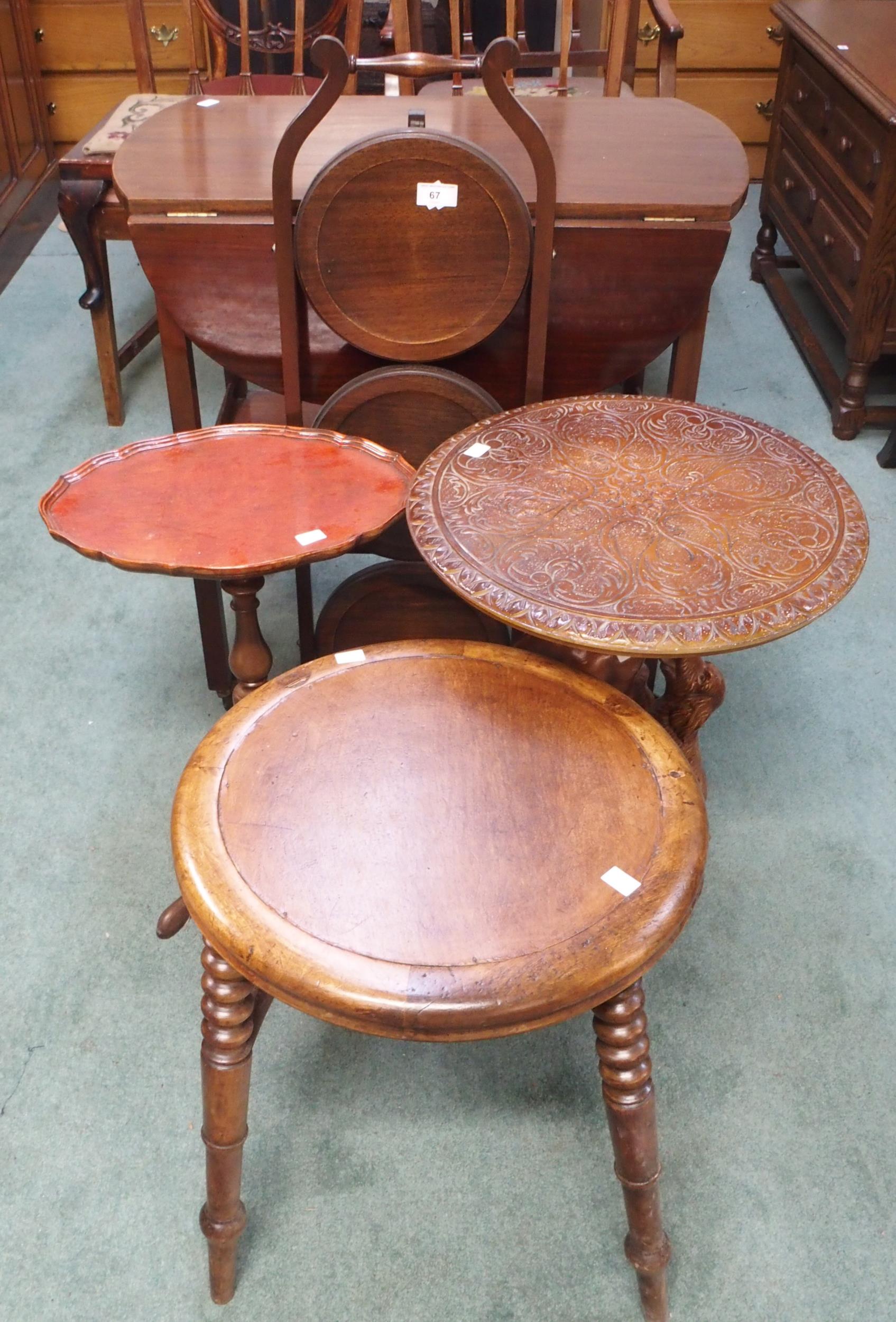 A Victorian circular stool on turned stretchered supports, mahogany trolley, three tier folding cake