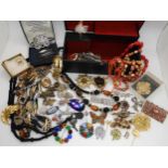 A good selection of vintage and retro gem set costume brooches, beads and other items Condition