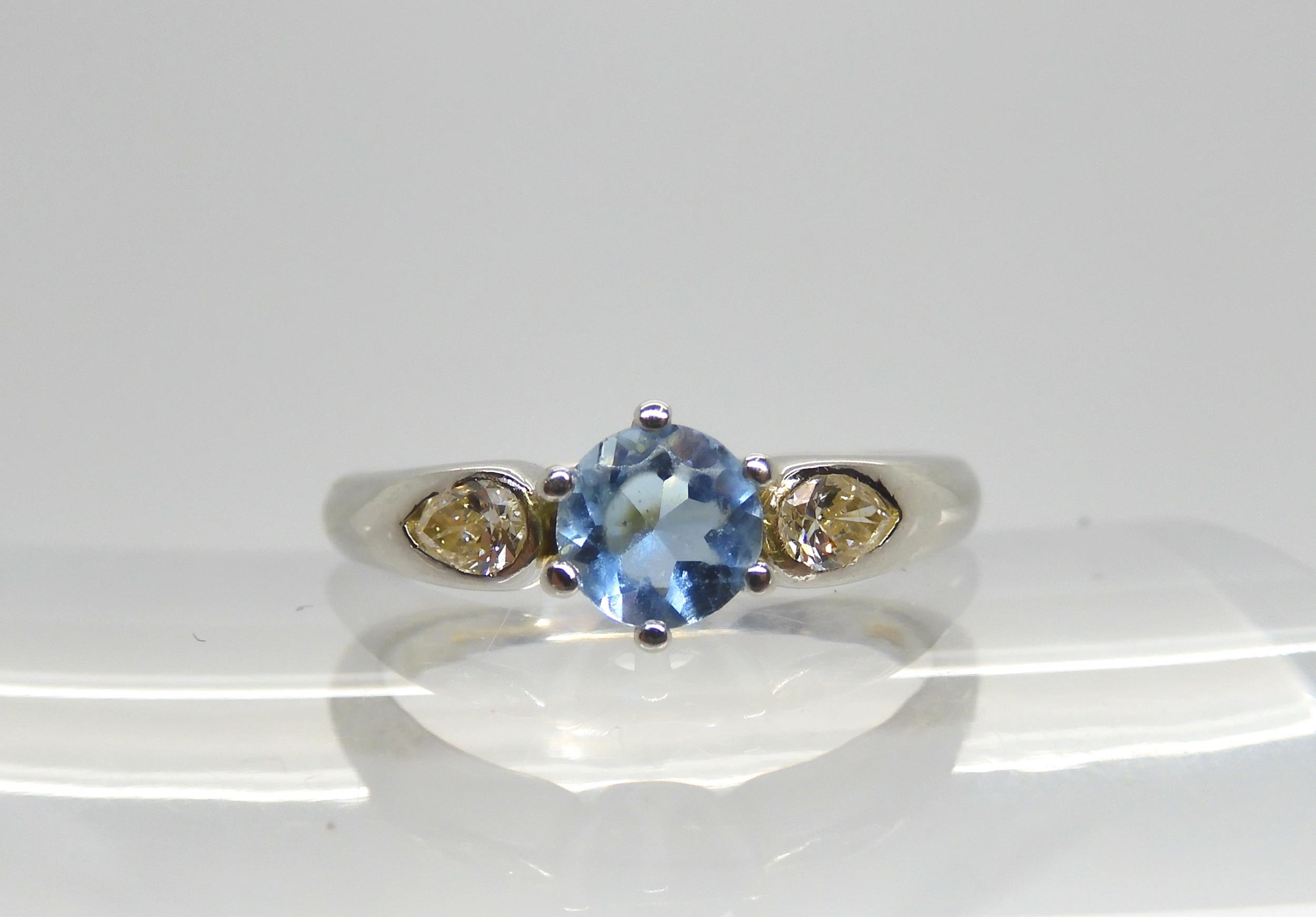 An 18ct white gold diamond and aquamarine ring, made by Boodles  set with estimated approx 0.10cts