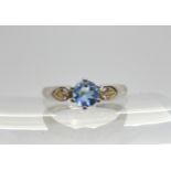 An 18ct white gold diamond and aquamarine ring, made by Boodles  set with estimated approx 0.10cts