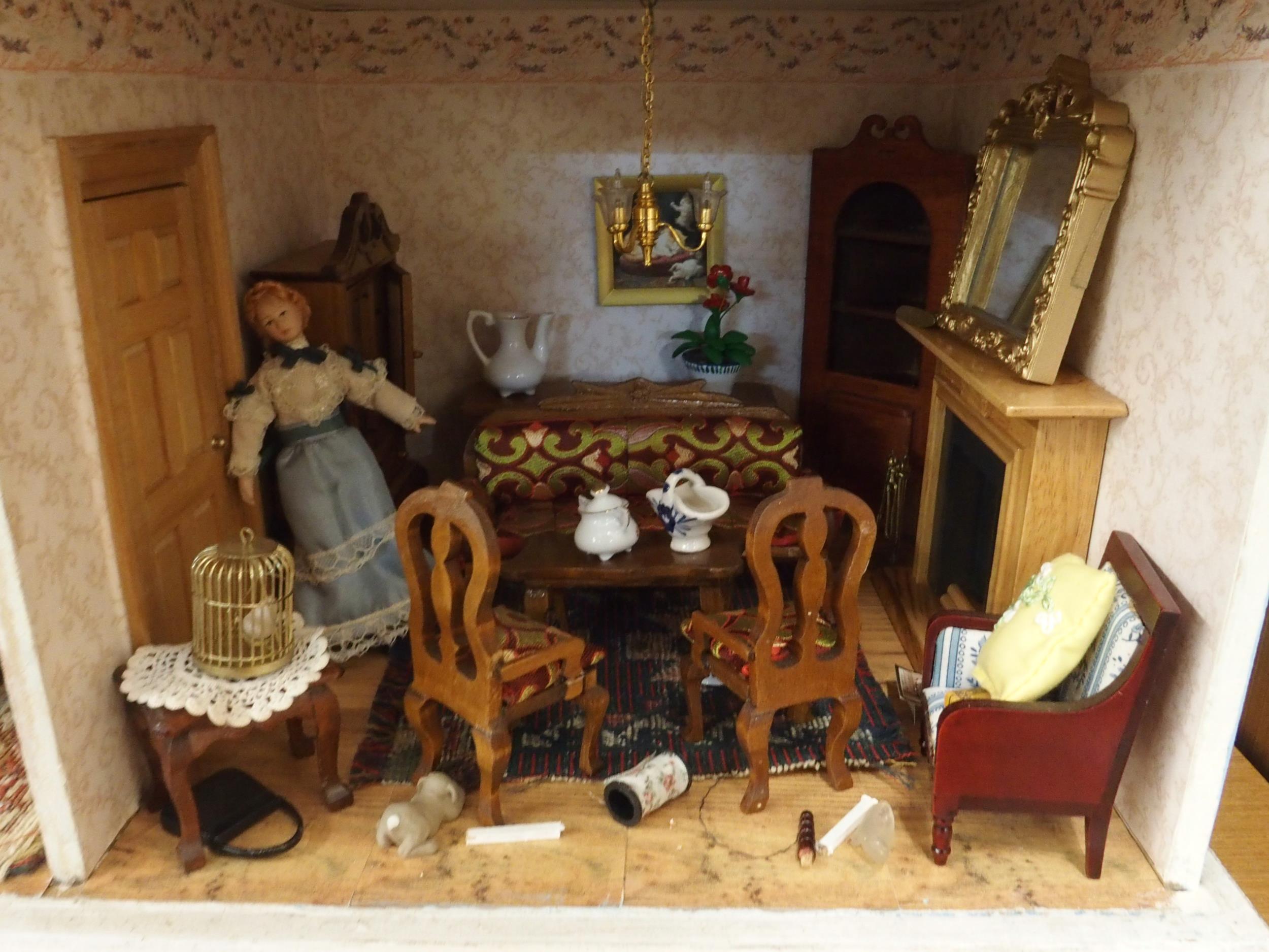 A 20th century three storey dolls house with assorted furniture and figures etc, 84cm high x 80cm - Image 12 of 13