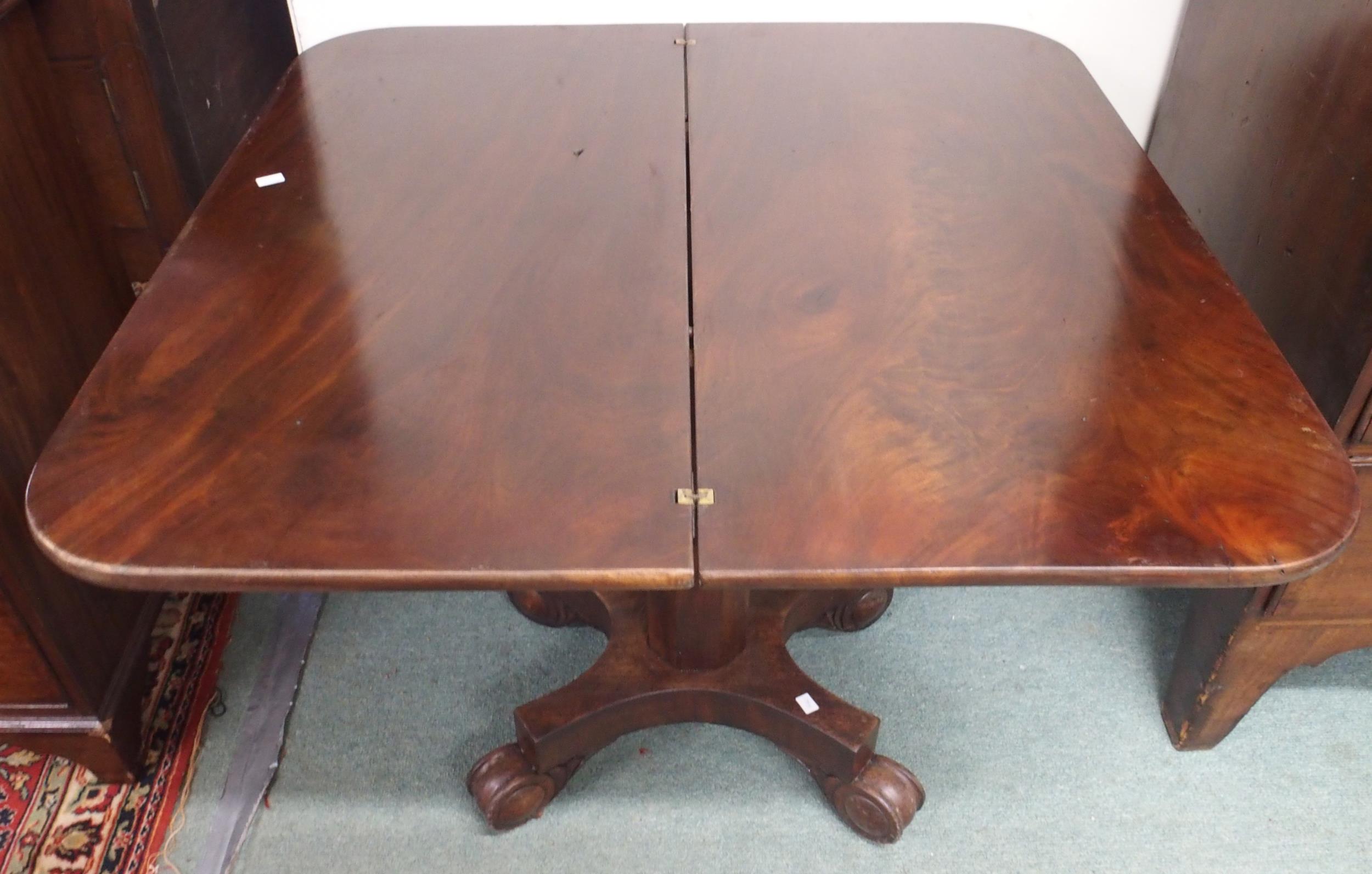 A Victorian mahogany fold-over tea table on octagonal pedestal terminating in scrolled quadrupedal - Image 4 of 4