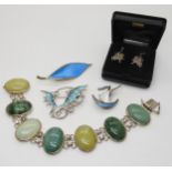 A pair of silver Ortak Maeshowe dragon earrings, a further silver and enamel dragon brooch, a