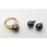 A 9ct ring set with a Cook Islands black pearl with matching earrings, with certificate from the