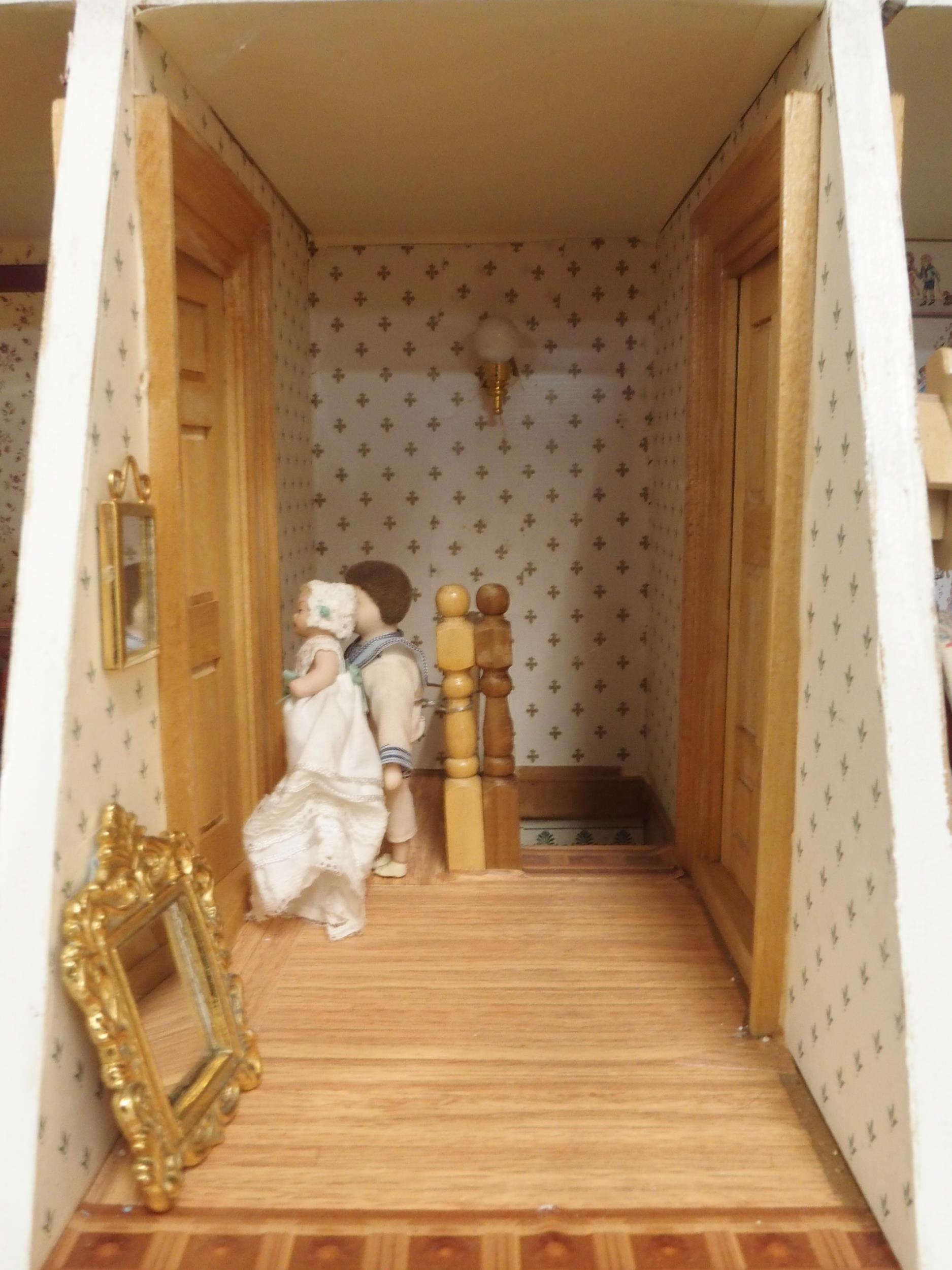 A 20th century three storey dolls house with assorted furniture and figures etc, 84cm high x 80cm - Image 5 of 13