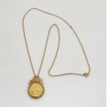 A 1908 full gold sovereign in an unusual 9ct gold leaf pattern pendant mount with a 9ct gold