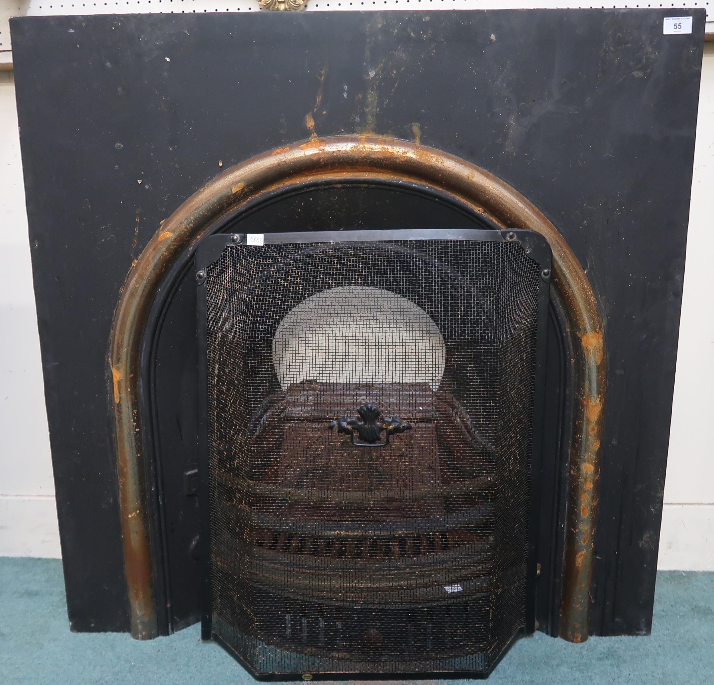 A Victorian cast iron fire place insert with integrated fire basket, 96cm high x 96cm wide x 26cm