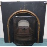 A Victorian cast iron fire place insert with integrated fire basket, 96cm high x 96cm wide x 26cm