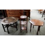 A 20th century Moorish style brass topped folding table, three tier folding cake stand and a