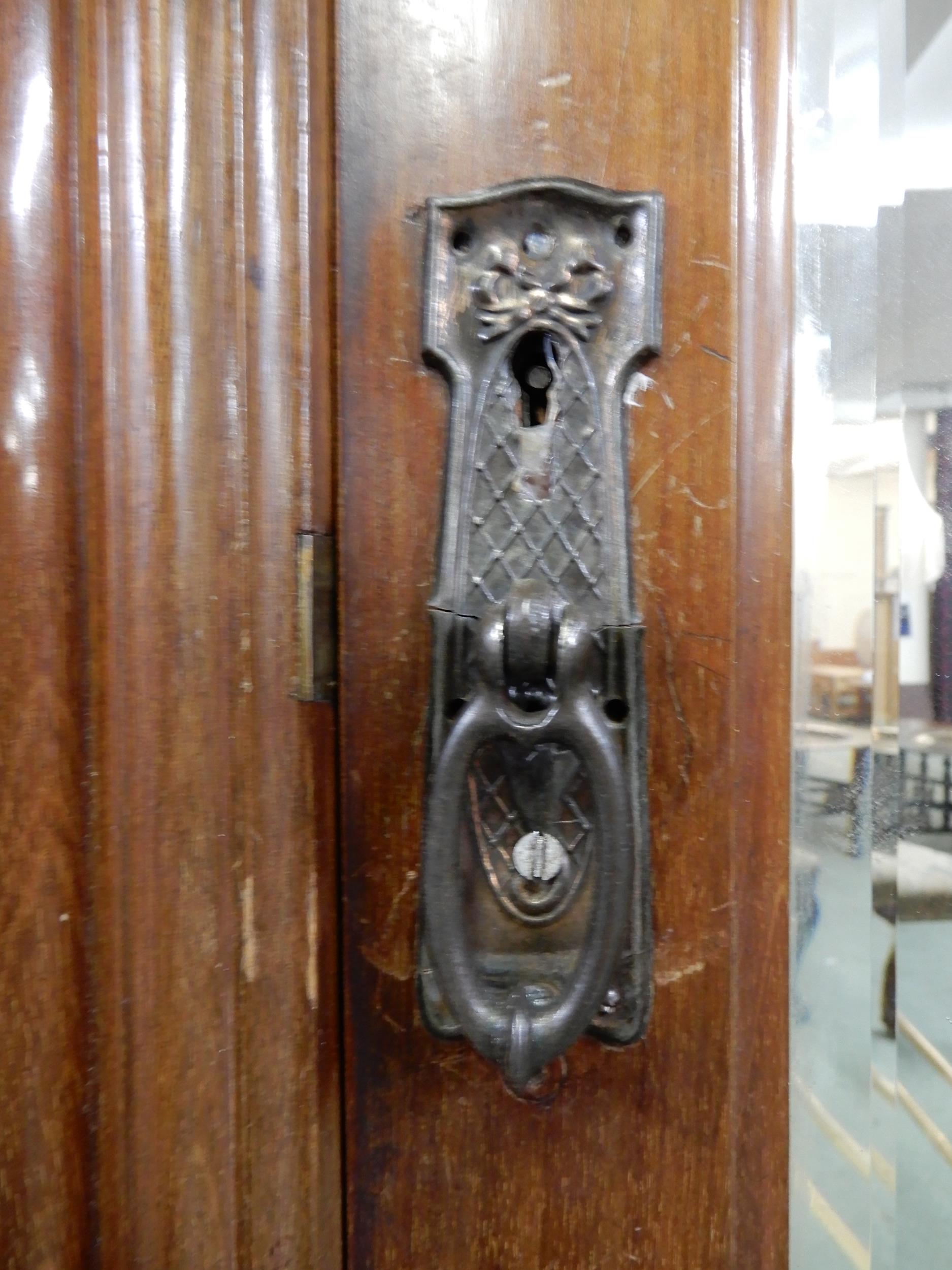 A late Victorian mahogany wardrobe with moulded cornice over single mirrored door over single drawer - Image 4 of 7