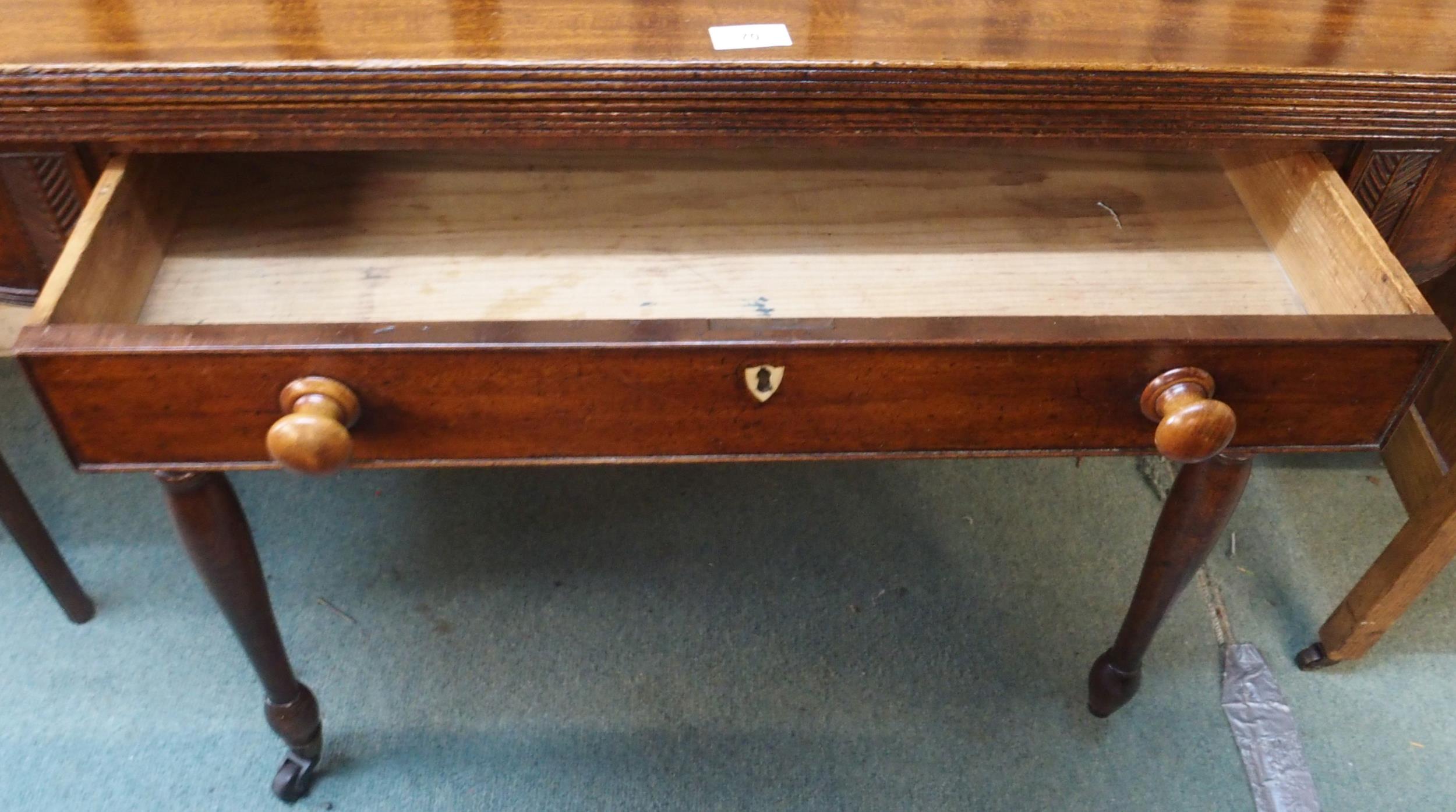 A Victorian mahogany single drawer fold-over tea table on turned supports terminating in casters ( - Image 2 of 4