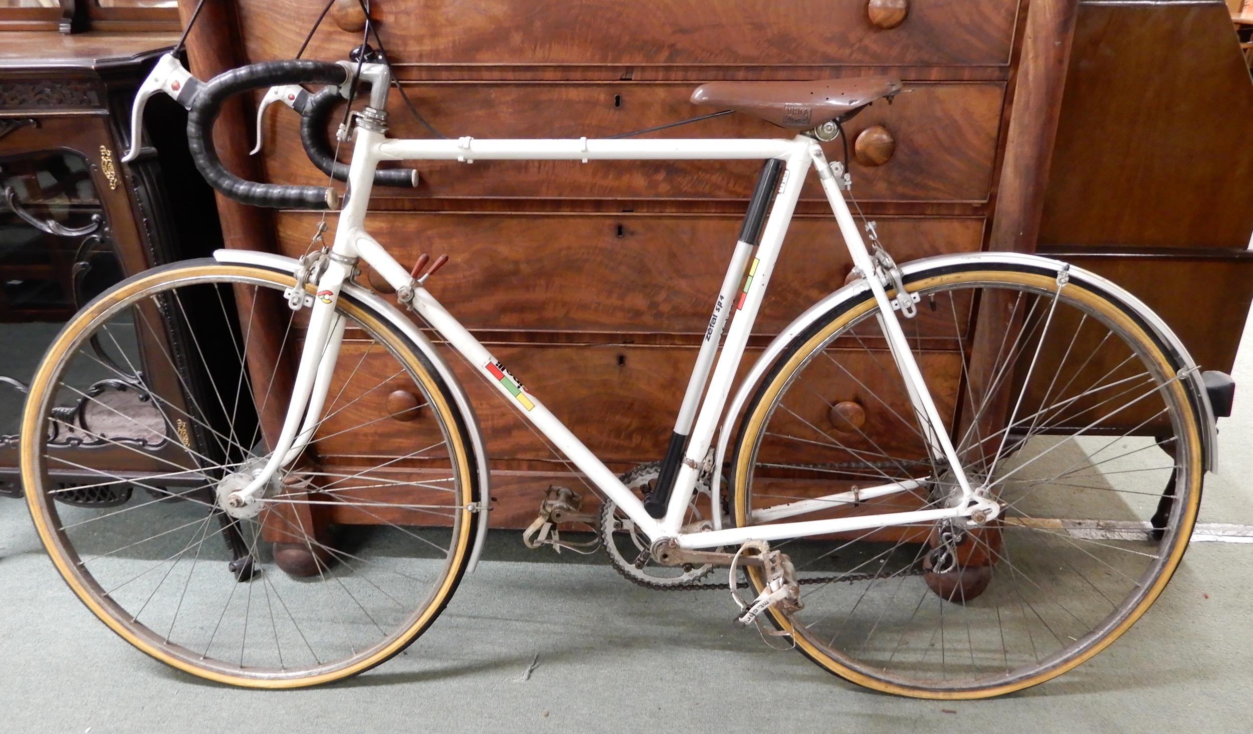 A mid 20th century Cinelli Milano racing bicycle with weinmann brakes and Unica saddle, 24 inch
