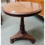 A Victorian rosewood circular topped occasional table on turned column base terminating in trefoil