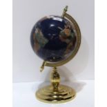 A medium hardstone globe of the world on gilt stand Condition Report:Available upon request