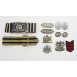 A Special Constable's striped armband, another similar buckled armband, police cap badges (including