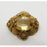 A yellow metal filigree brooch set with a large citrine of approx 23mm x 1.8mm, weight 13.3gms