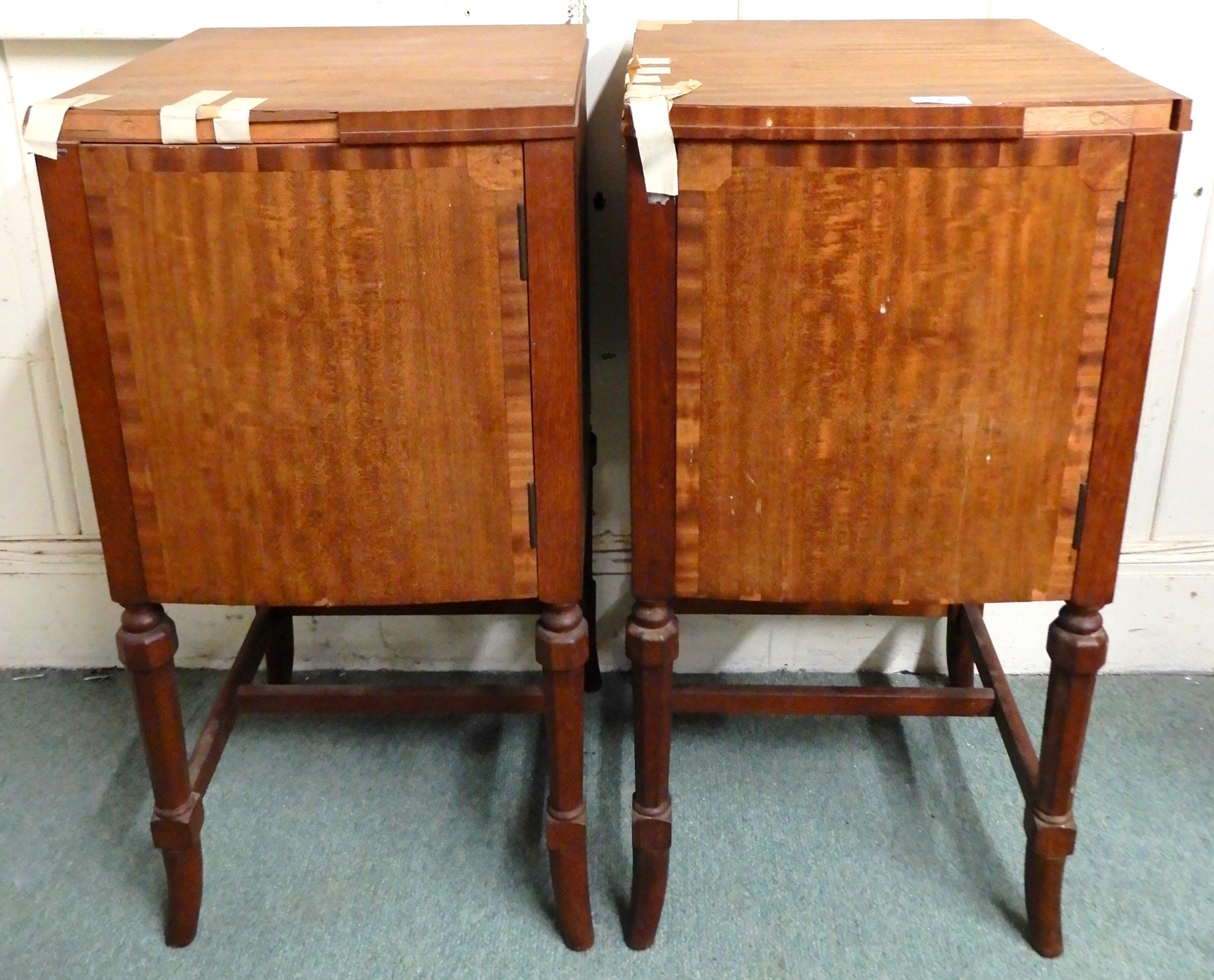 A pair of 20th century mahogany single door bedside cabinets on stretchered shaped supports, 78cm