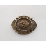 A Victorian yellow metal Etruscan revival style brooch with locket back, length 4.5cm, weight 11.