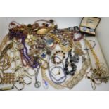 A quantity of vintage costume jewellery to include multicolour rhinestone necklace and bracelet set,