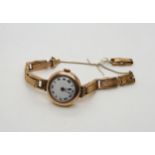 A 9ct rose gold ladies vintage watch and strap, weight including mechanism 23.1gms Condition
